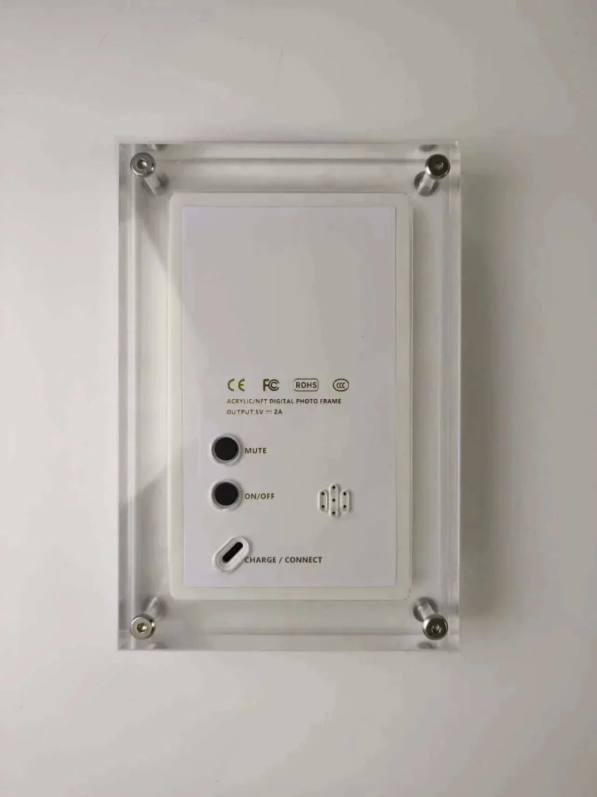 Back view of 7 inches digital photo and video display frame with buttons and ports in sleek transparent casing